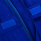 Construction close-up of the RigArmor cotton coverall, available in six colours including navy blue, orange and white